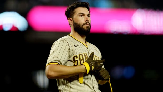 Aug 14, 2021; Phoenix, Arizona, USA; San Diego Padres first baseman Eric Hosmer (30) sheds his batting gloves after striking out against the Arizona Diamondbacks during the fifth inning at Chase Field.